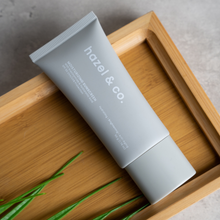Load image into Gallery viewer, Hazel & Co. Moisturizing Sunscreen SPF 50 UVA/UVB Protection 50g | With Niacinamide, Hyaluronic Acid, Hydrating, Brightening, Anti-Aging