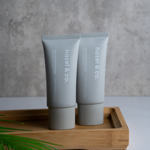 Load image into Gallery viewer, Hazel & Co. Moisturizing Sunscreen SPF 50 UVA/UVB Protection 50g | With Niacinamide, Hyaluronic Acid, Hydrating, Brightening, Anti-Aging